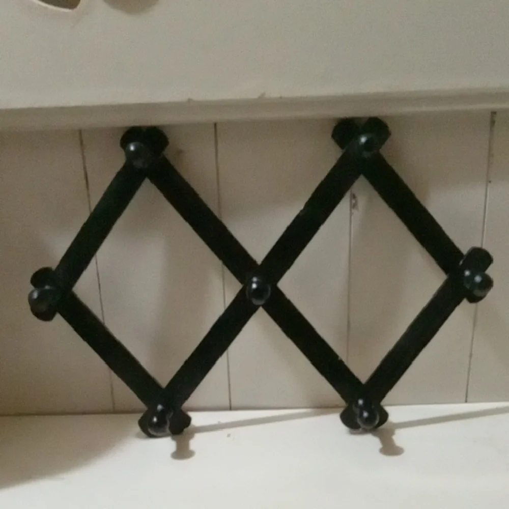 Black Wall-Mounted Coat Rack.